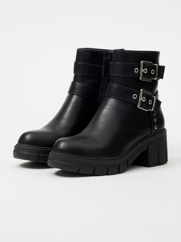 Ankle boot with track sole buckles black 45º front view