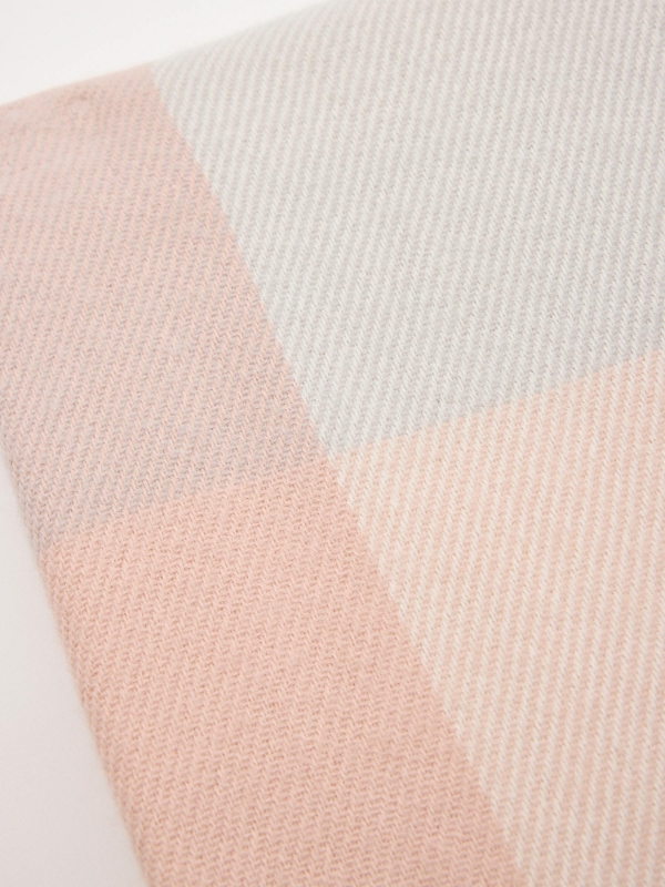 Poncho pink tones grey close-up view