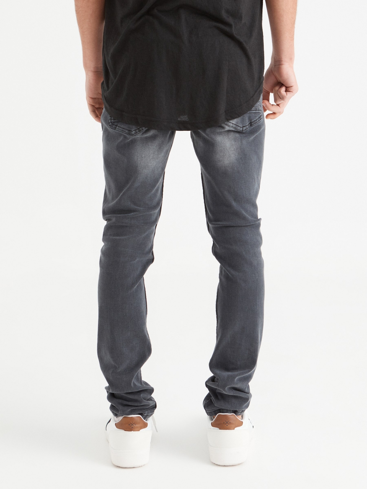 Ripped washed gray slim jeans dark grey middle back view