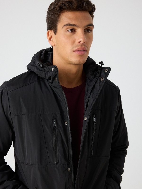 Hooded black parka black detail view