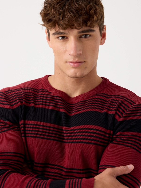 Striped ribbed knit jumper candle foreground