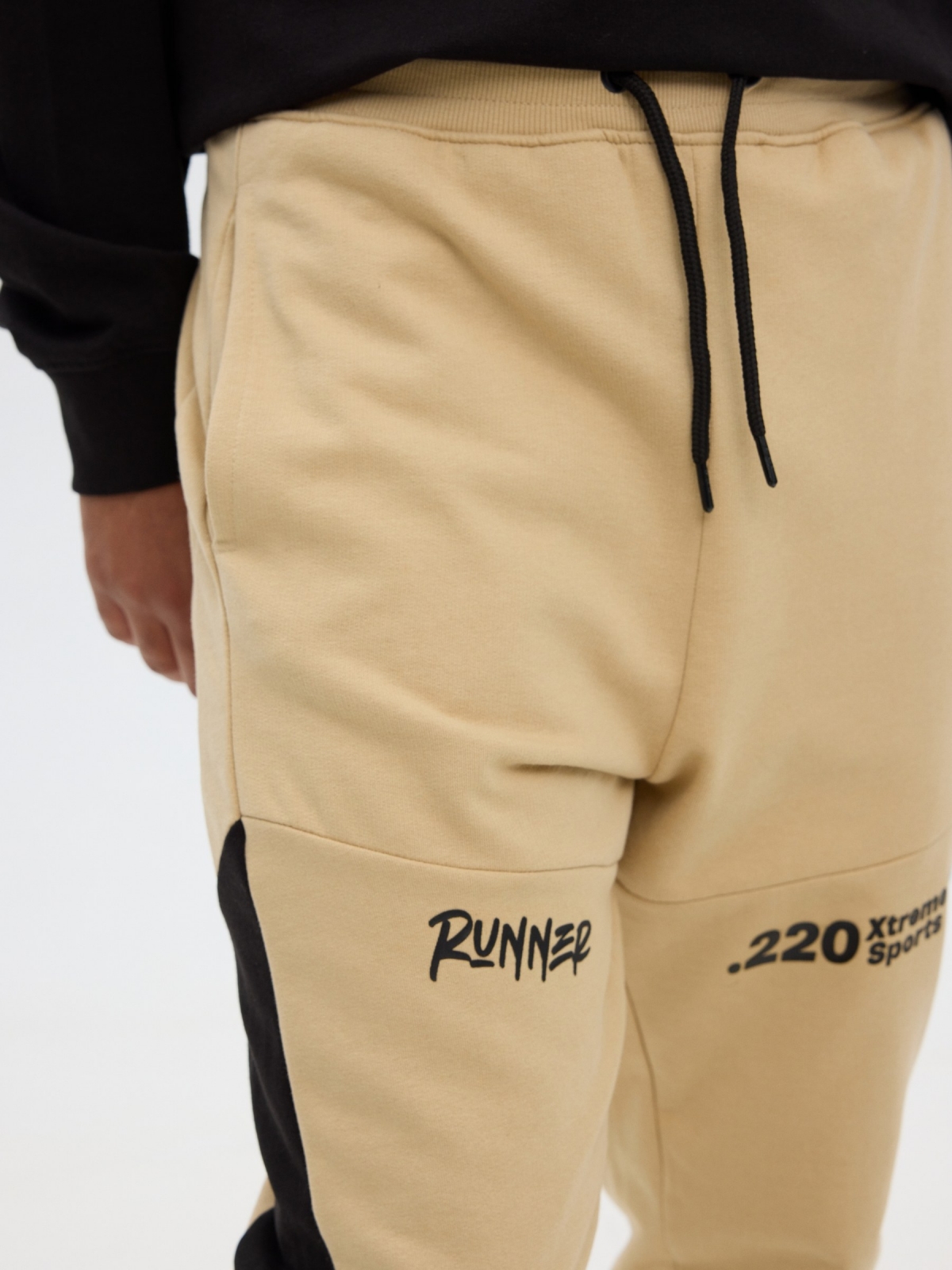 Jogger pants sand detail view