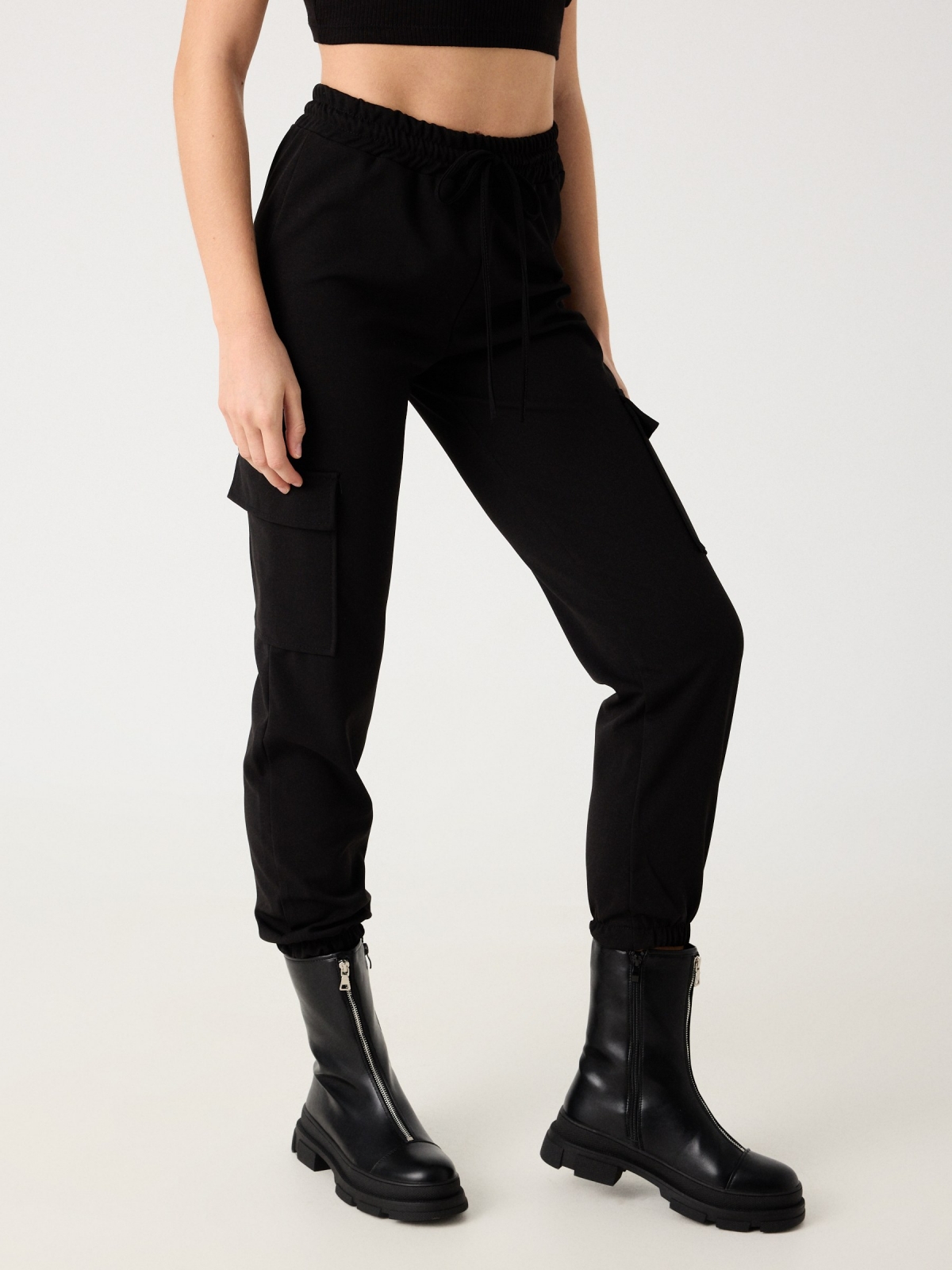 Rubber cargo pants black detail view