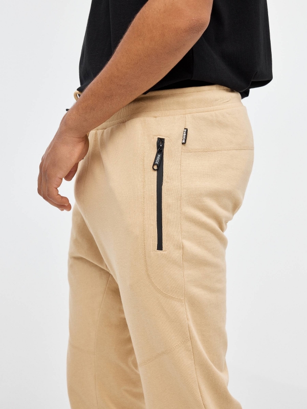 Jogger pants with pockets sand detail view