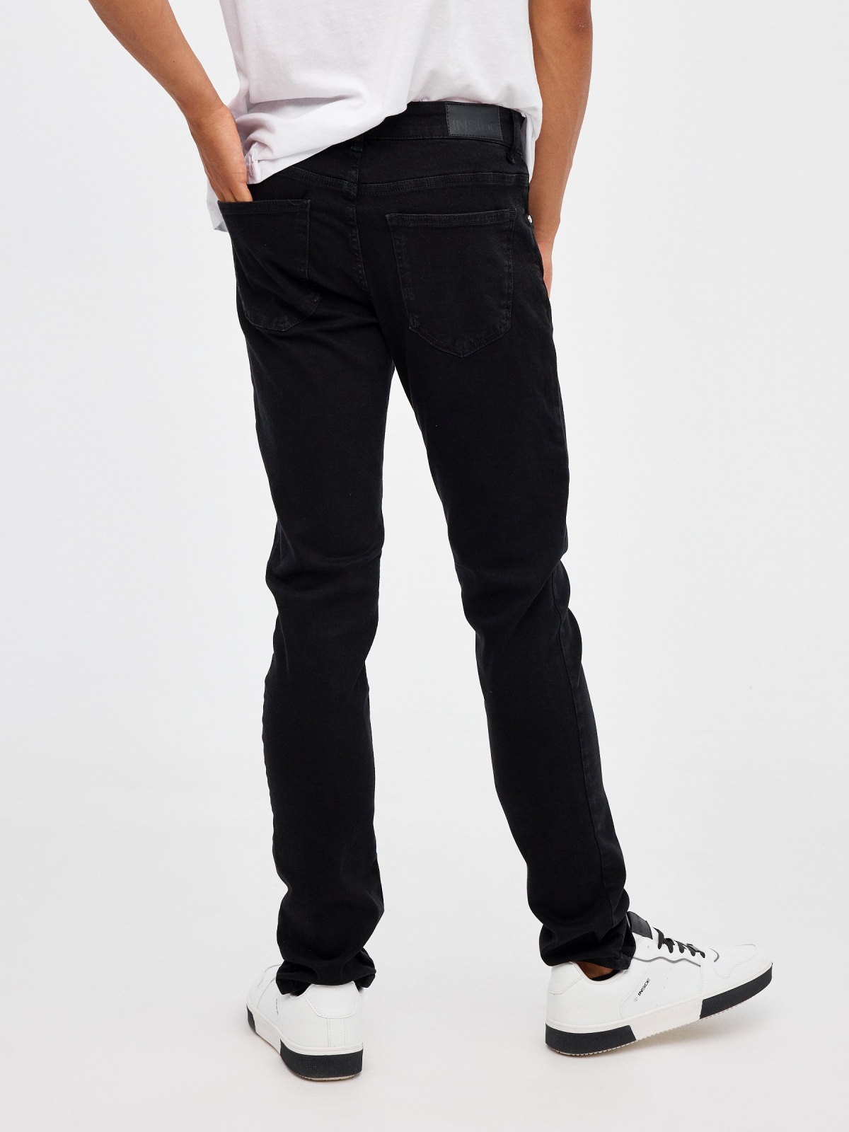 Jeans slim denim negro negro vista media trasera