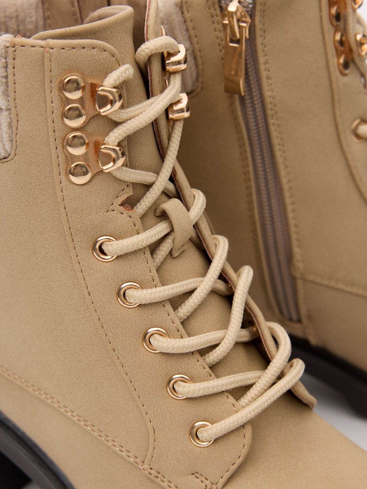 Ankle boots with buckle and collar beige detail view