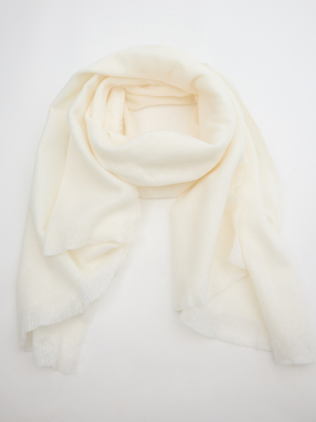 Colored knitted scarf off white rolled view