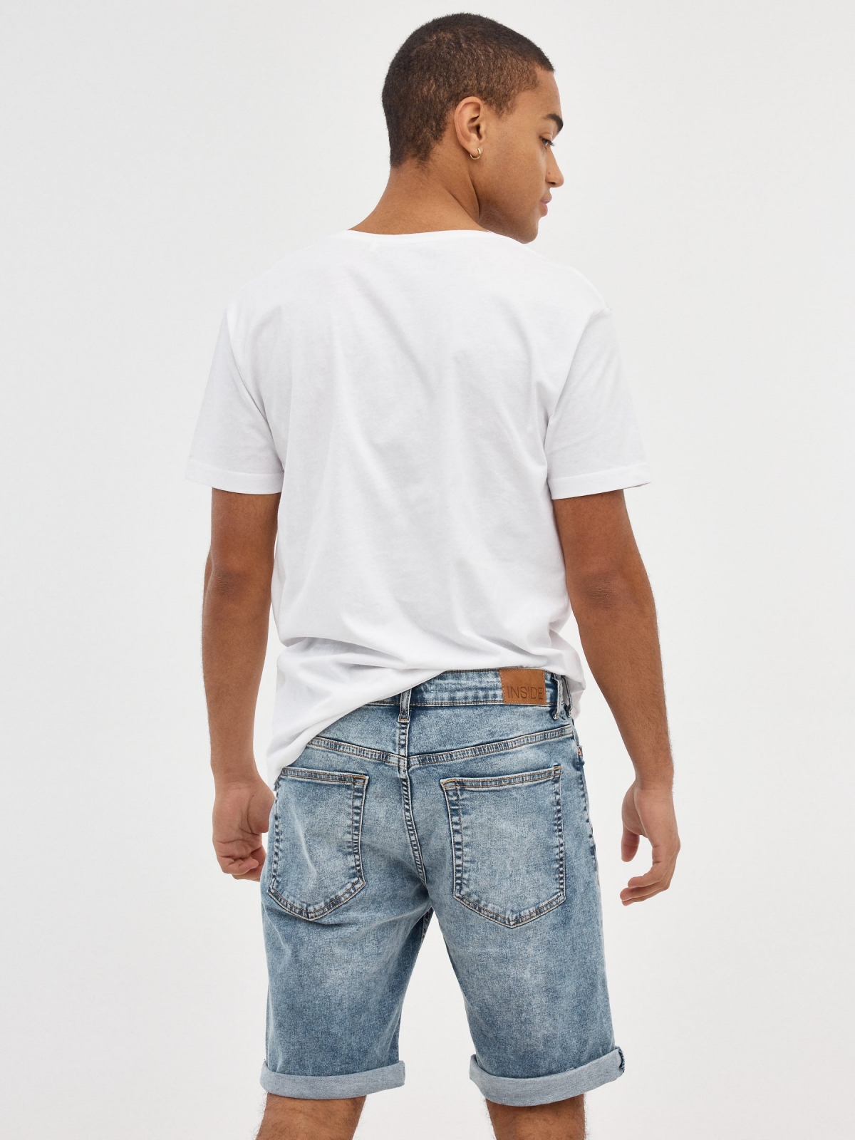 Bermuda Skinny Denim Bermuda shorts worn out blue middle back view