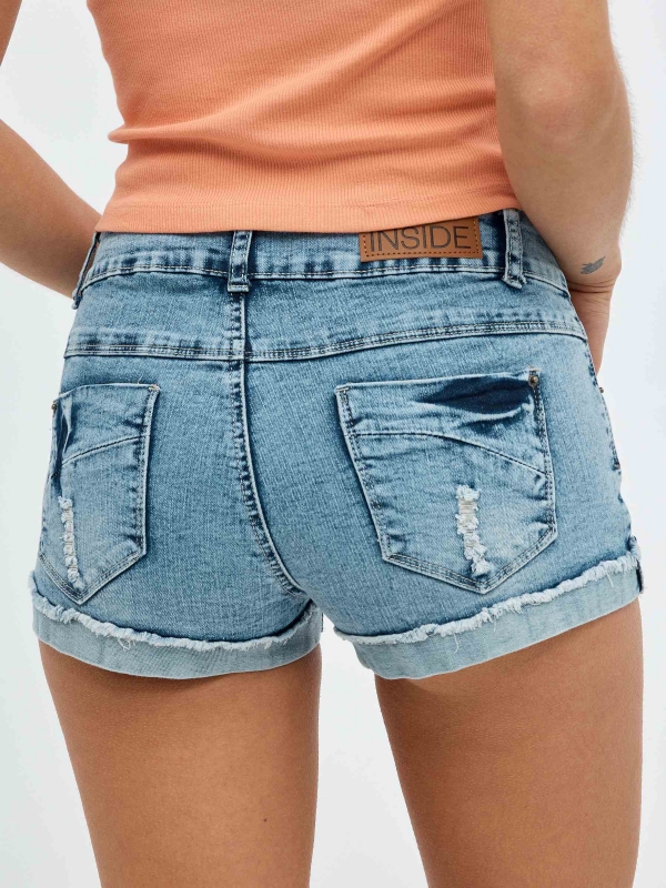 Ripped washed effect denim shorts blue detail view