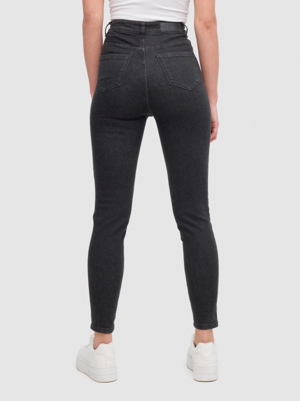 Jeans skinny tiro alto negro negro vista media trasera