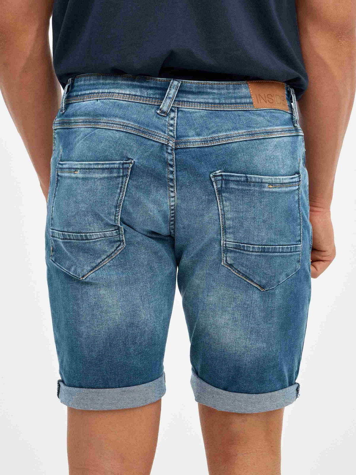 Distressed blue denim bermuda blue detail view