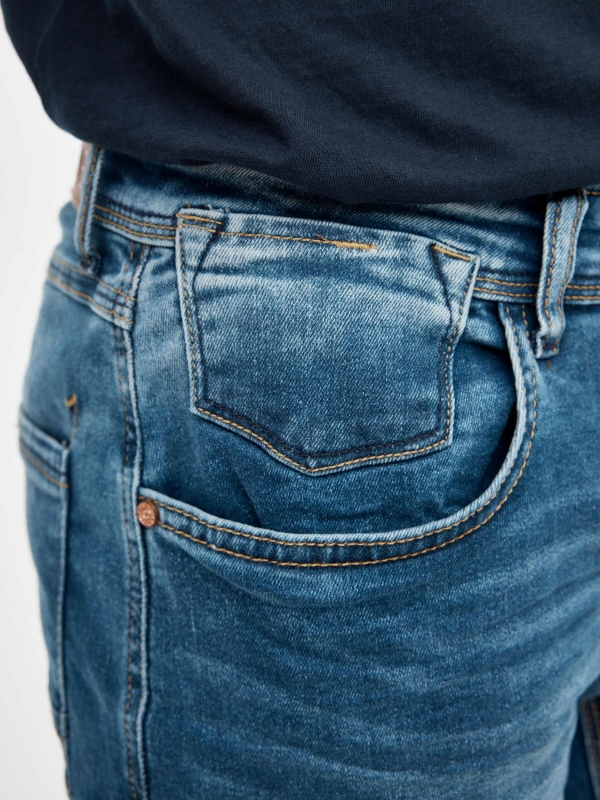 Distressed blue denim bermuda blue detail view