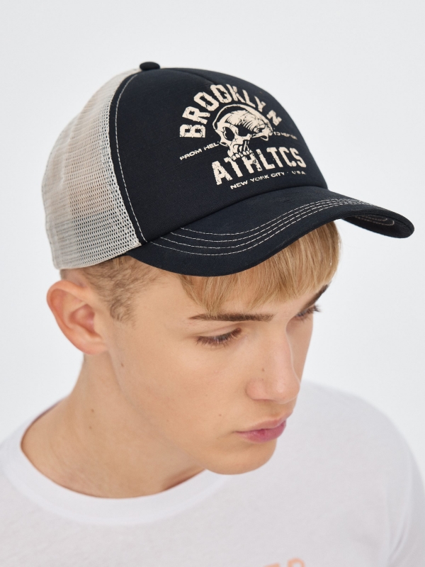 Contrast trucker cap black with a model