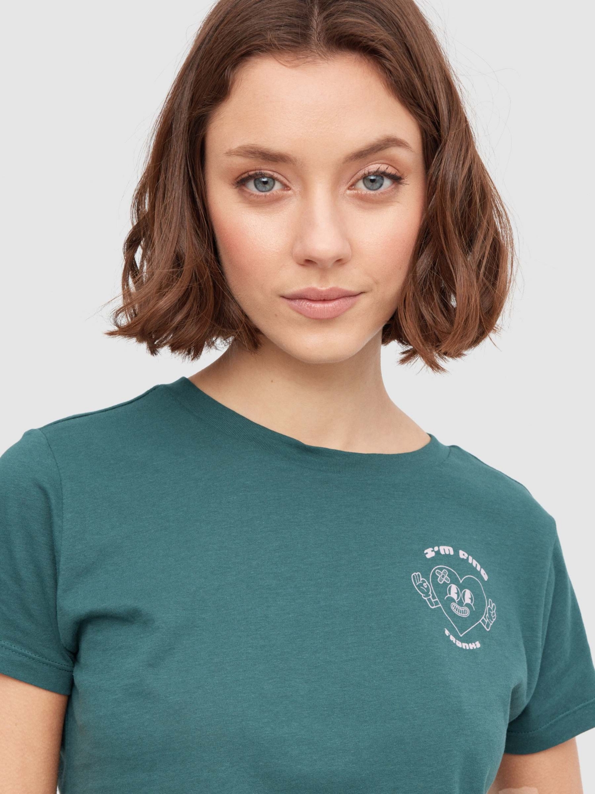 Smiling heart crop top dark green detail view