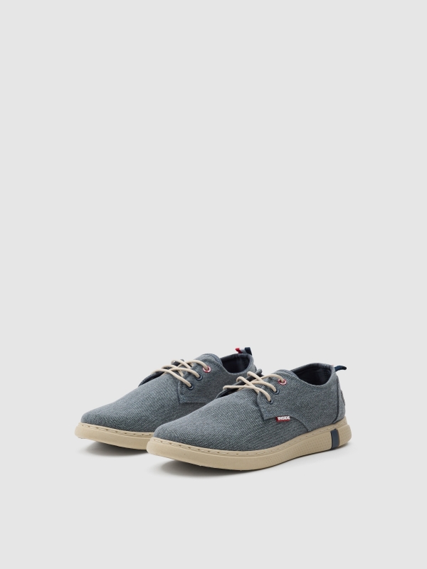 Worn canvas sneaker dark blue 45º front view