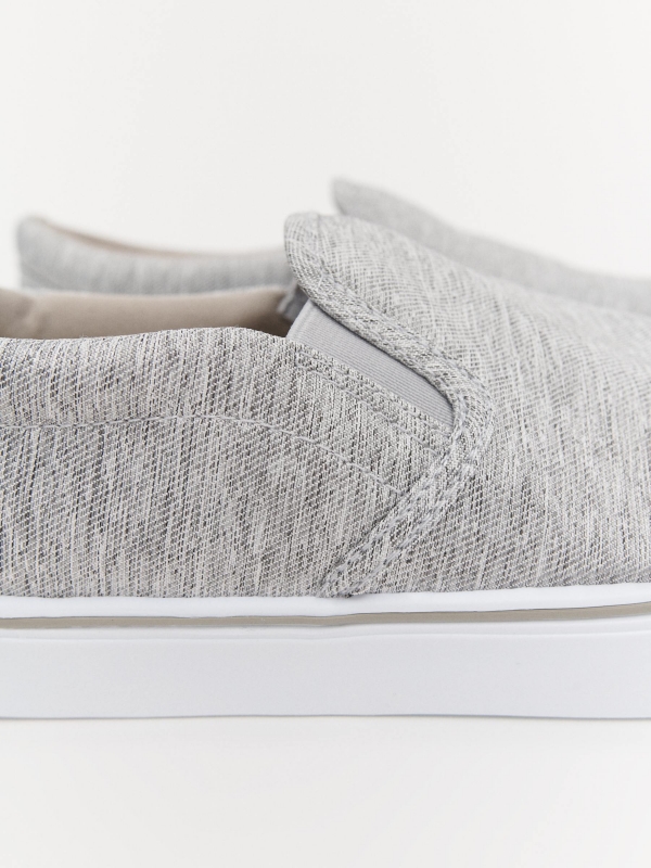 Gray canvas sneaker detail view