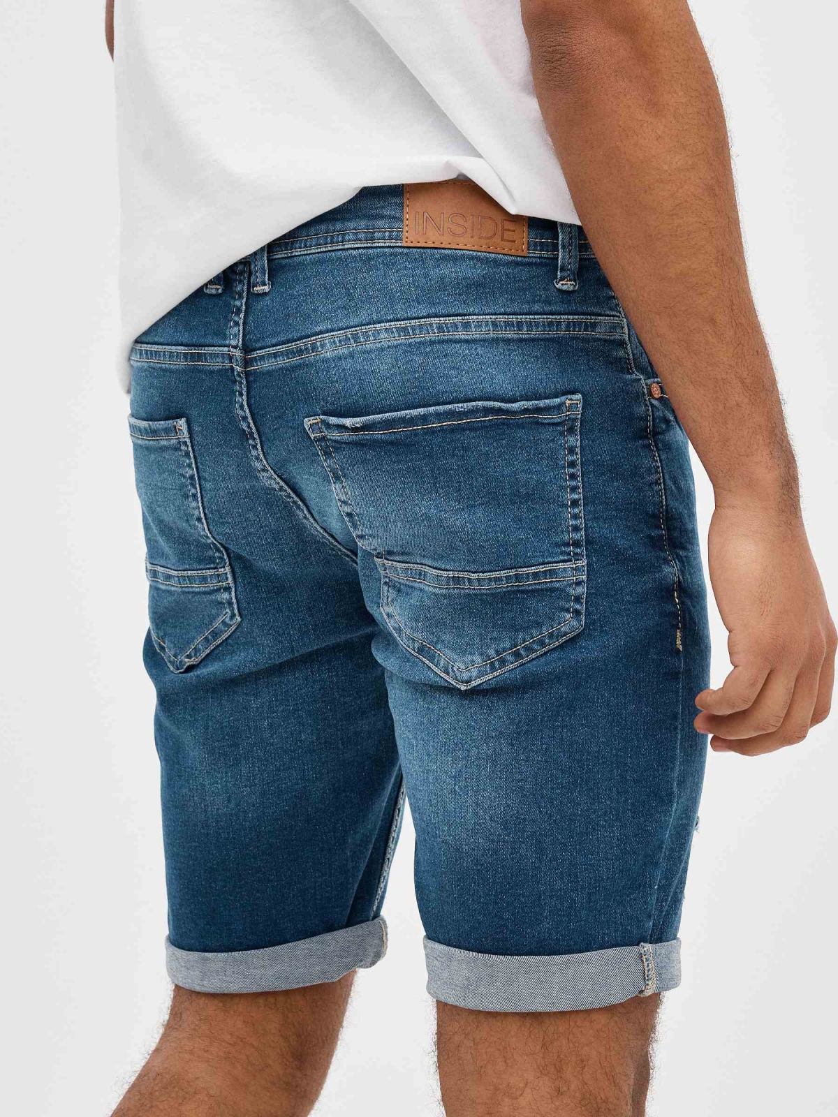 Ripped distressed denim bermuda short blue detail view