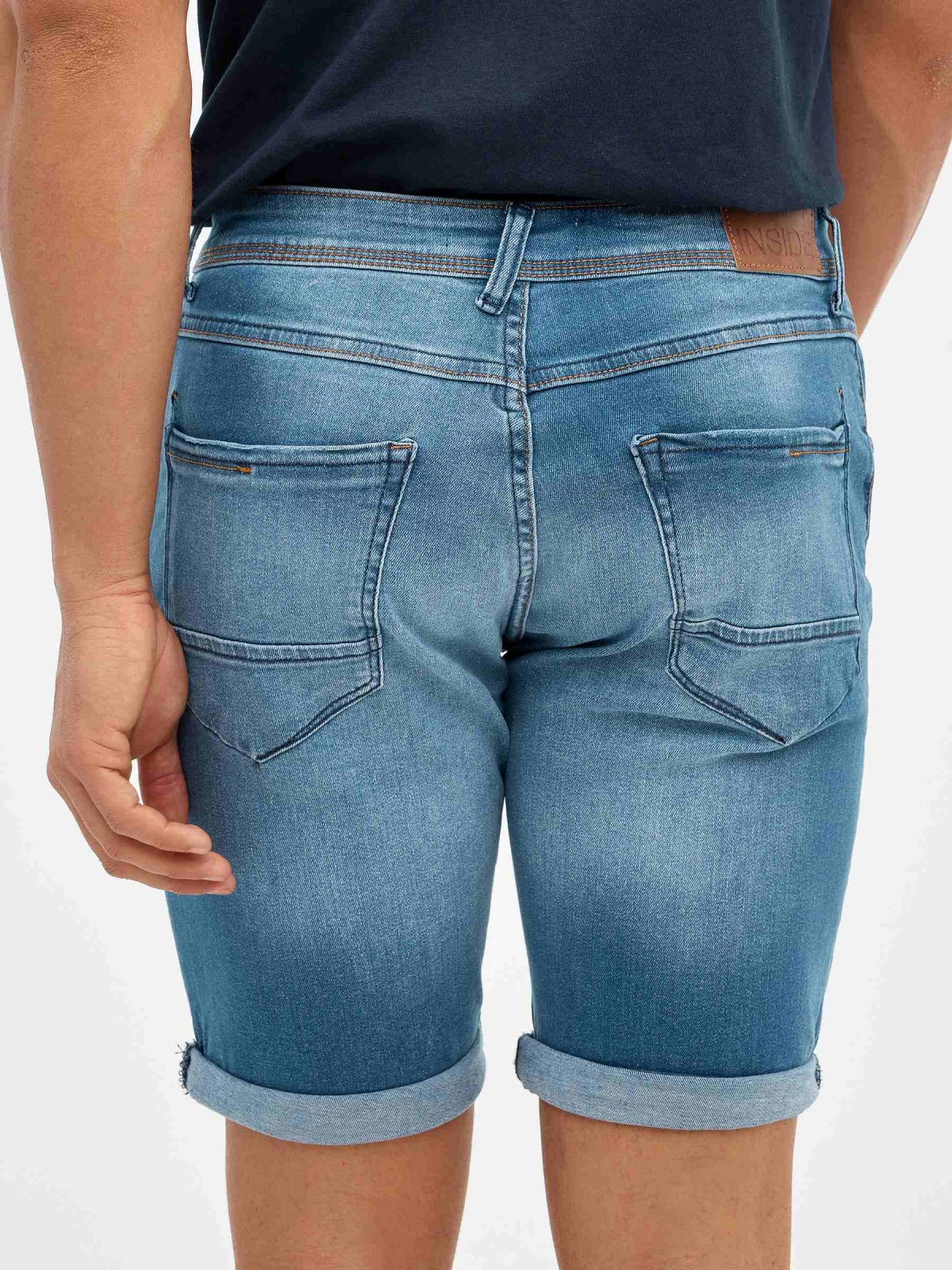 Ripped distressed denim bermuda short blue detail view