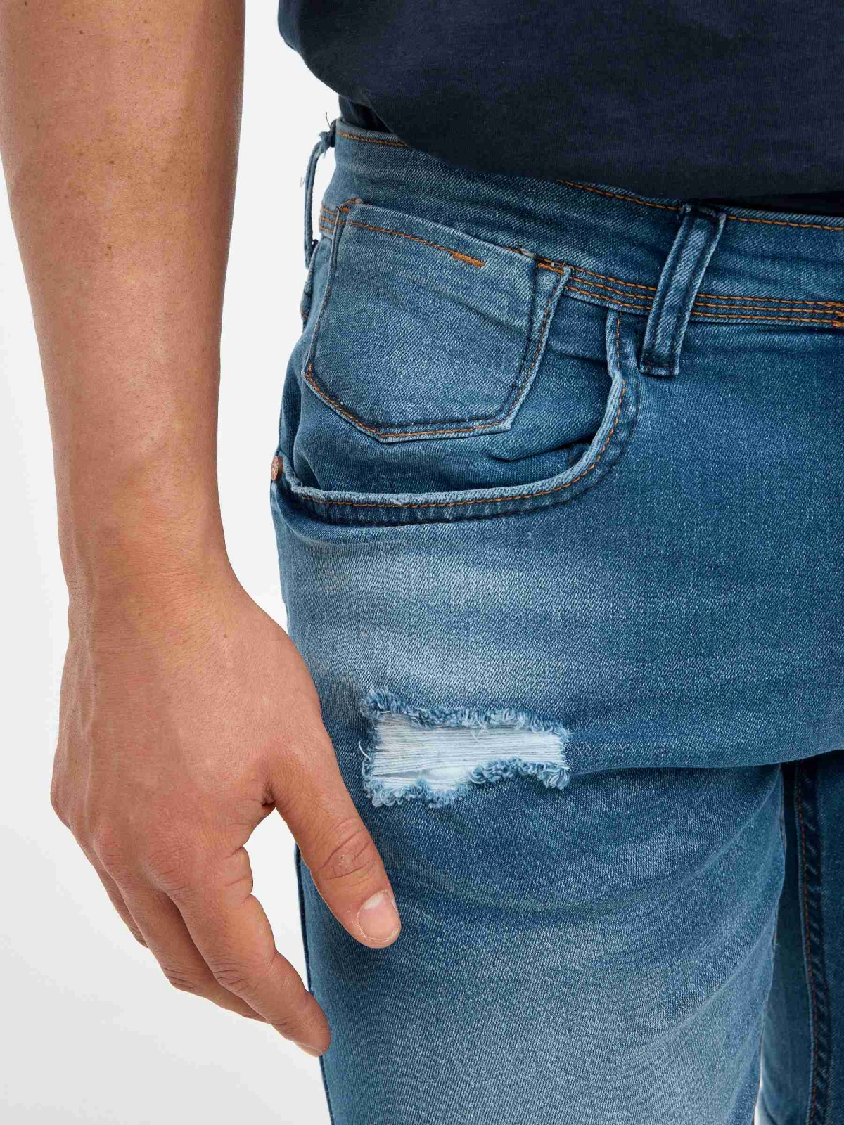 Ripped distressed denim bermuda short blue detail view