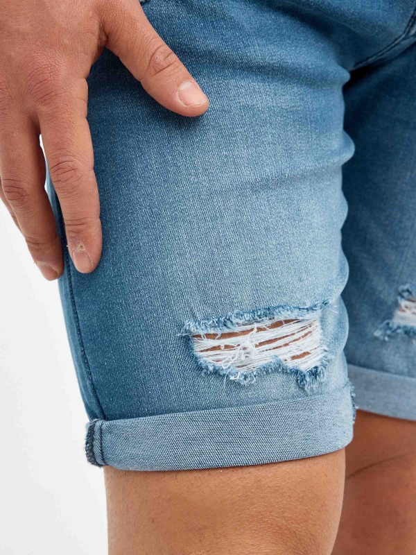 Ripped distressed denim bermuda short blue detail view