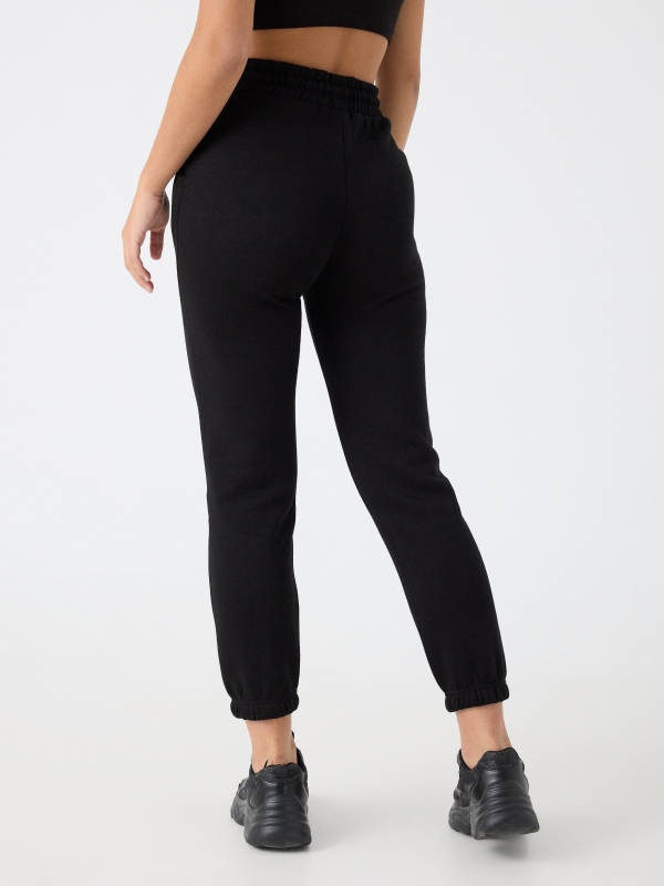 Pantalón jogger felpa negro vista media trasera