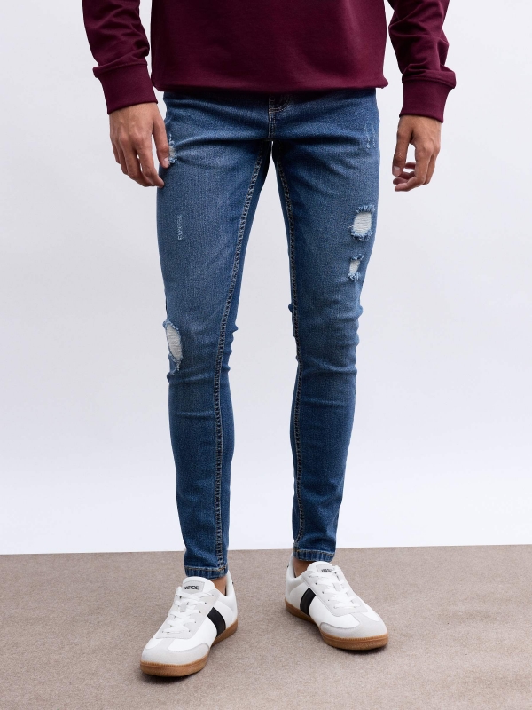 Jeans skinny con rotos azul vista media frontal