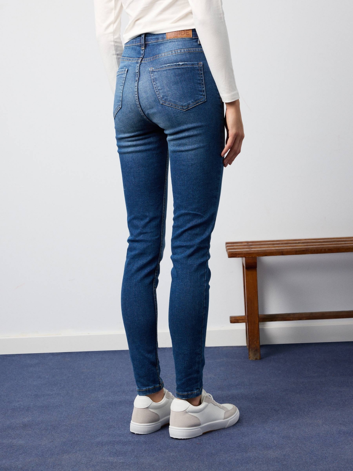 High-waisted skinny jeans with washed effect navy middle back view