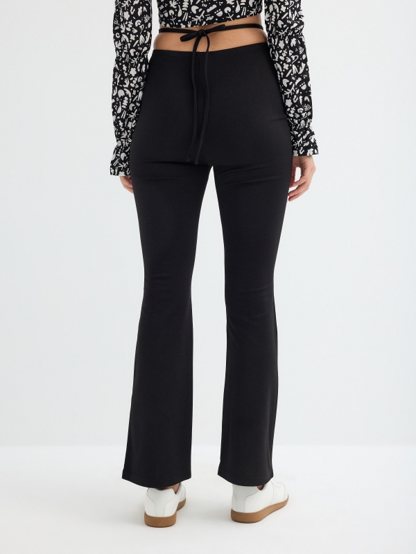 Flared pants with tie waist black middle back view