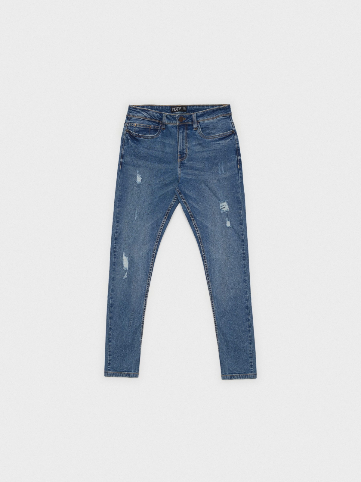 Skinny jeans with rips blue detail view