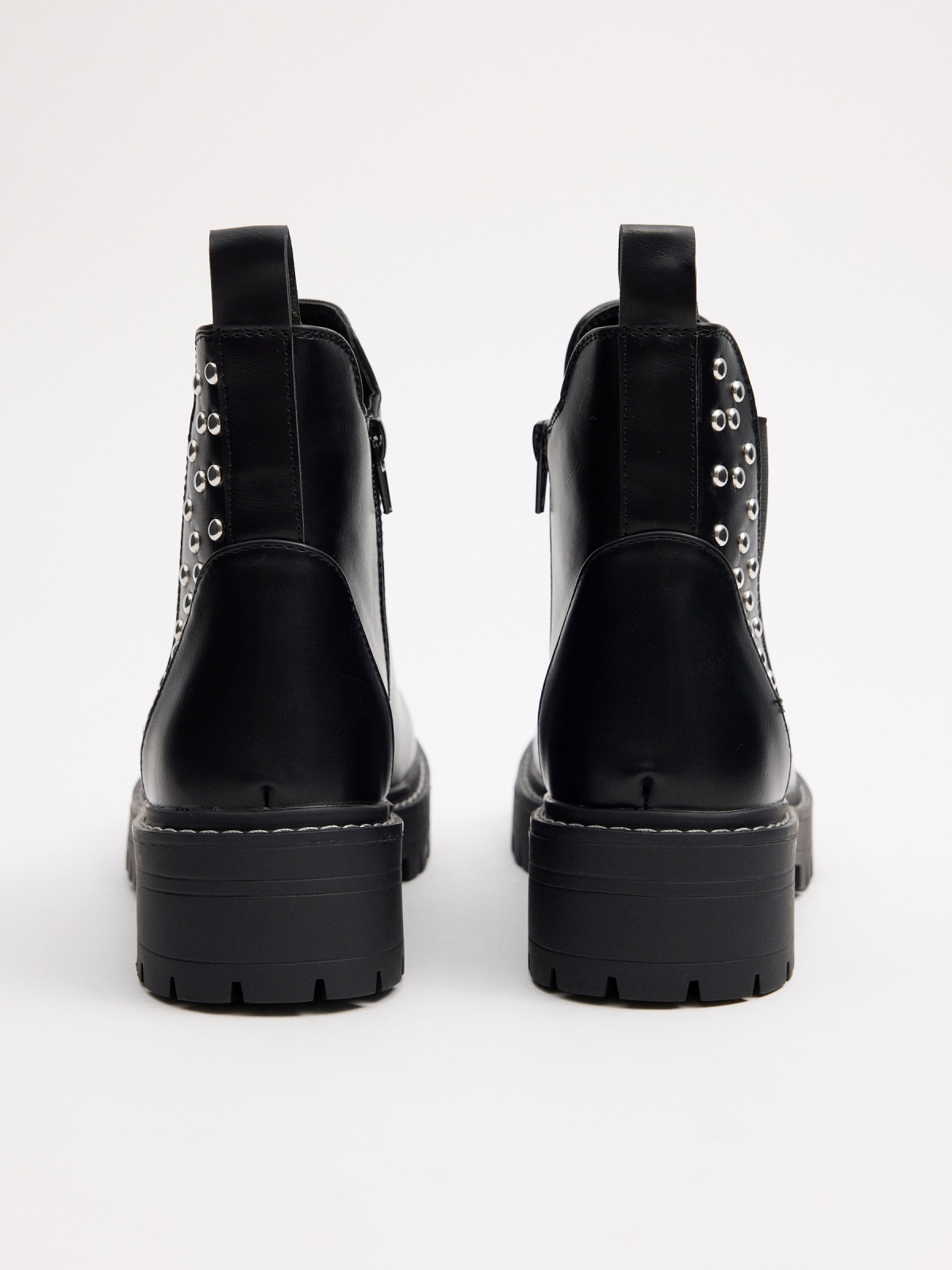 Studded elastic ankle boots detail view