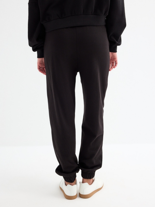 Club jogger pants black middle back view