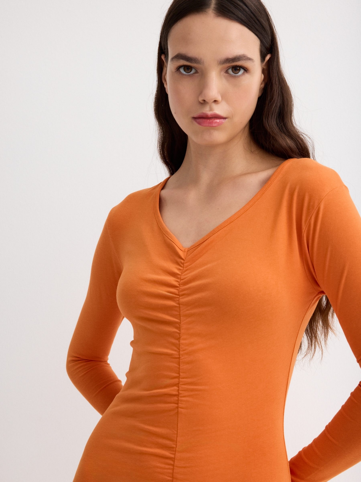 Orange mini dress with ruffles orange front detail view