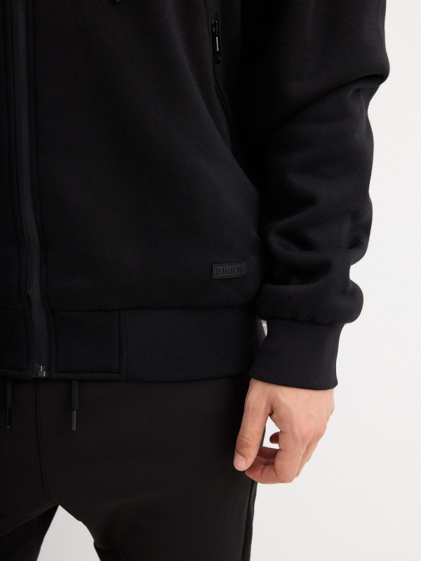 Combined hooded jacket black detail view