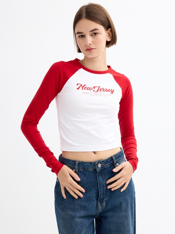 Long sleeve raglan crop top with graphics carmine middle front view