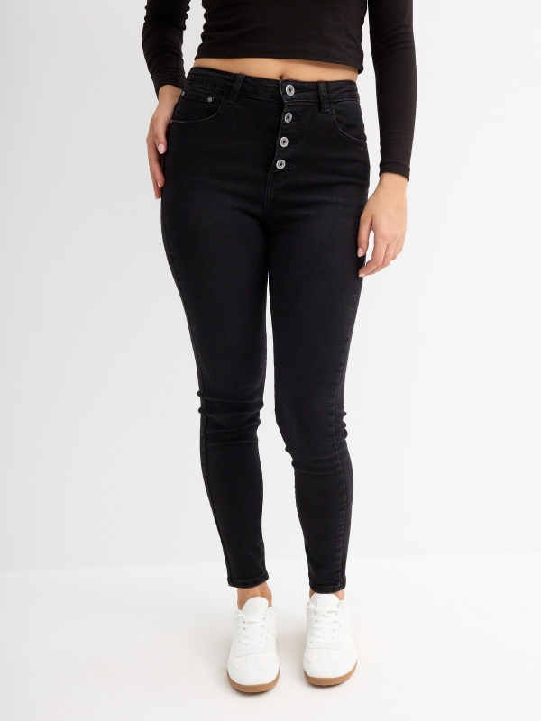 Skinny pants with buttons black middle front view