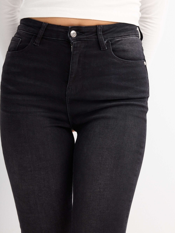 Black high rise skinny jeans black detail view