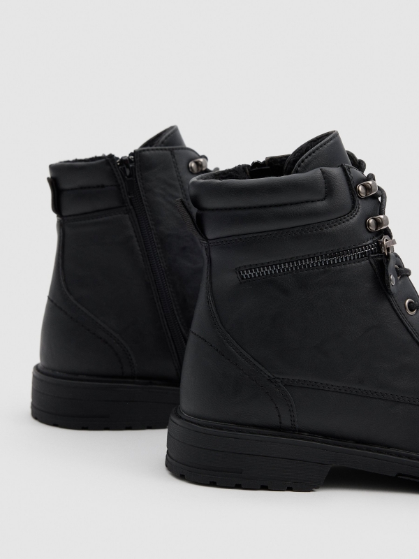 Black military boot with zip black detail view