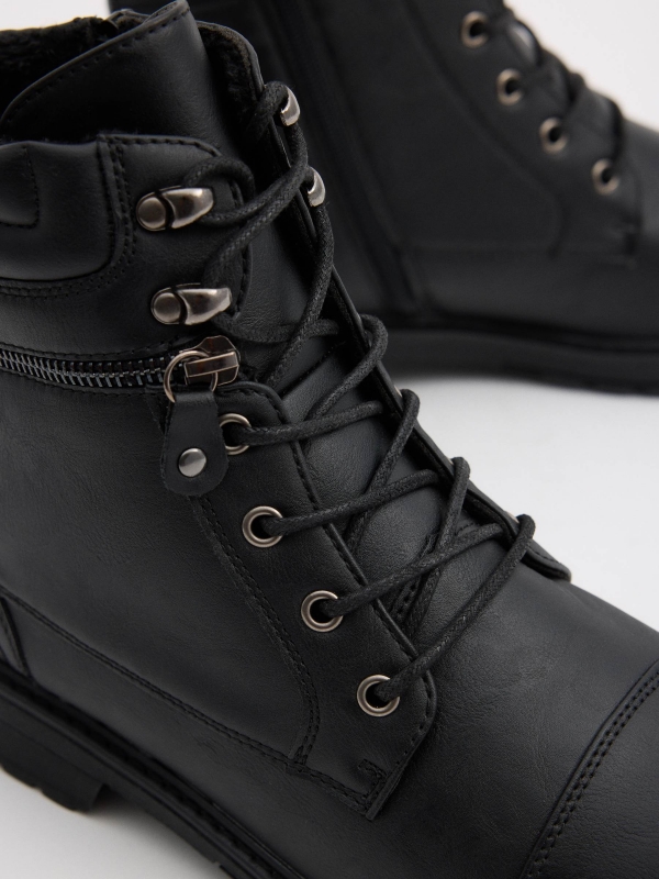 Black military boot with zip black detail view