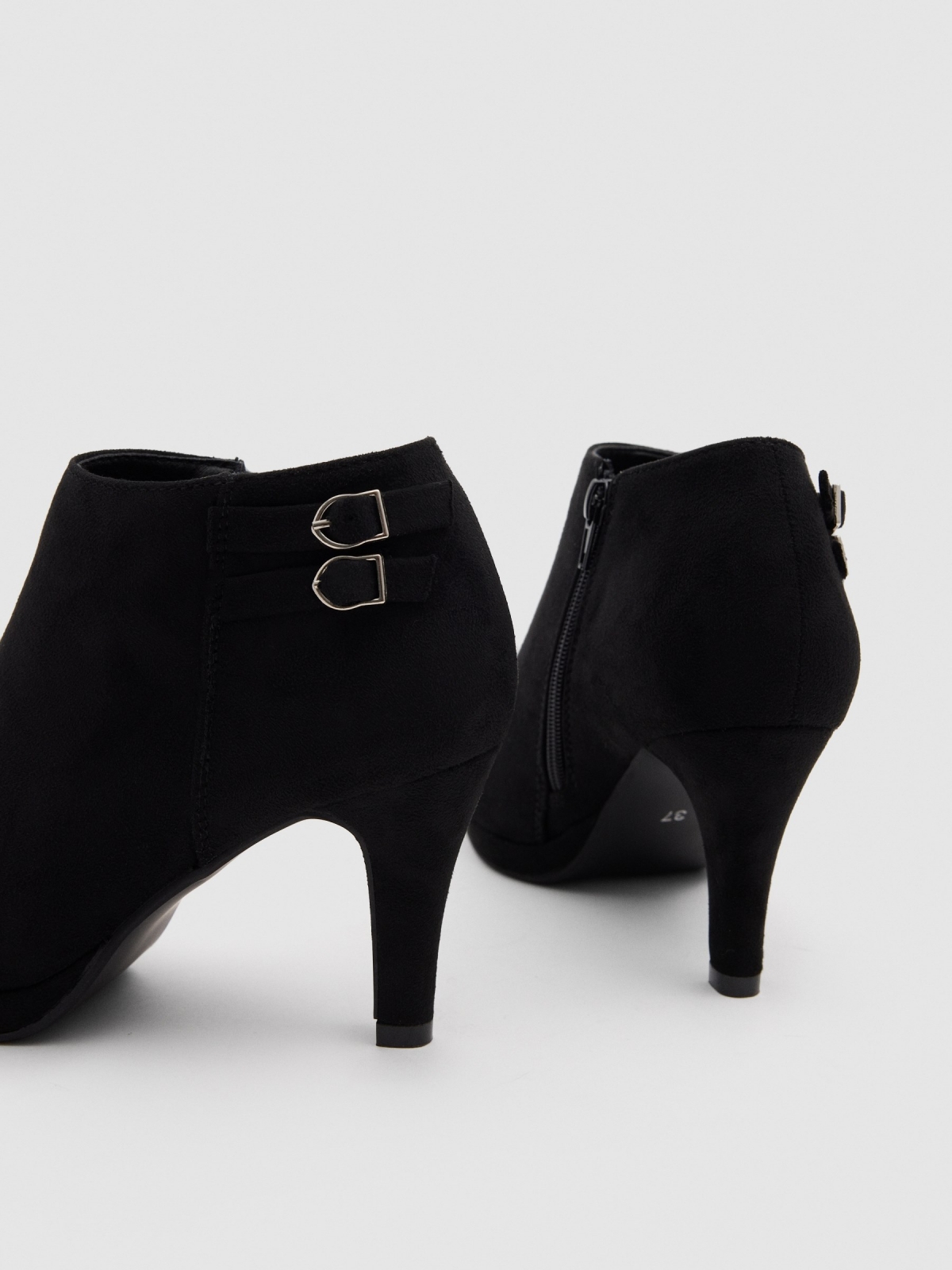 Heeled ankle boot with 2 buckles black detail view