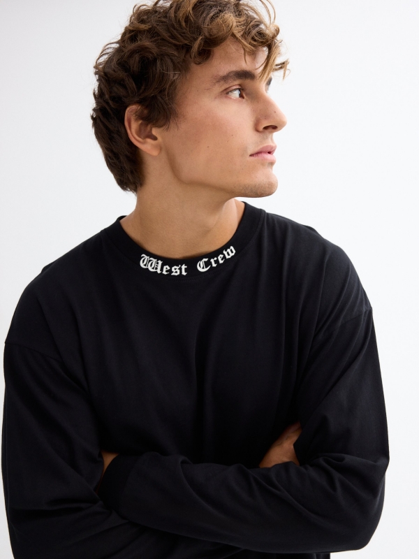 Long sleeve black t-shirt with graphic black detail view