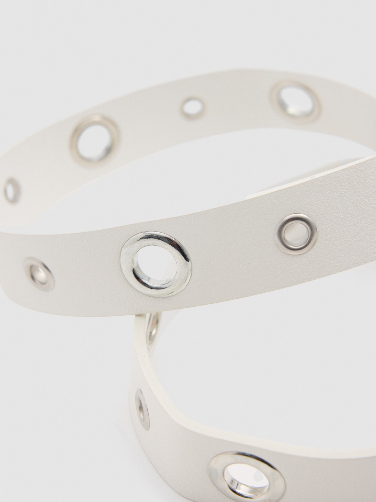 White leatherette belt with eyelets and round buckle beige detail view