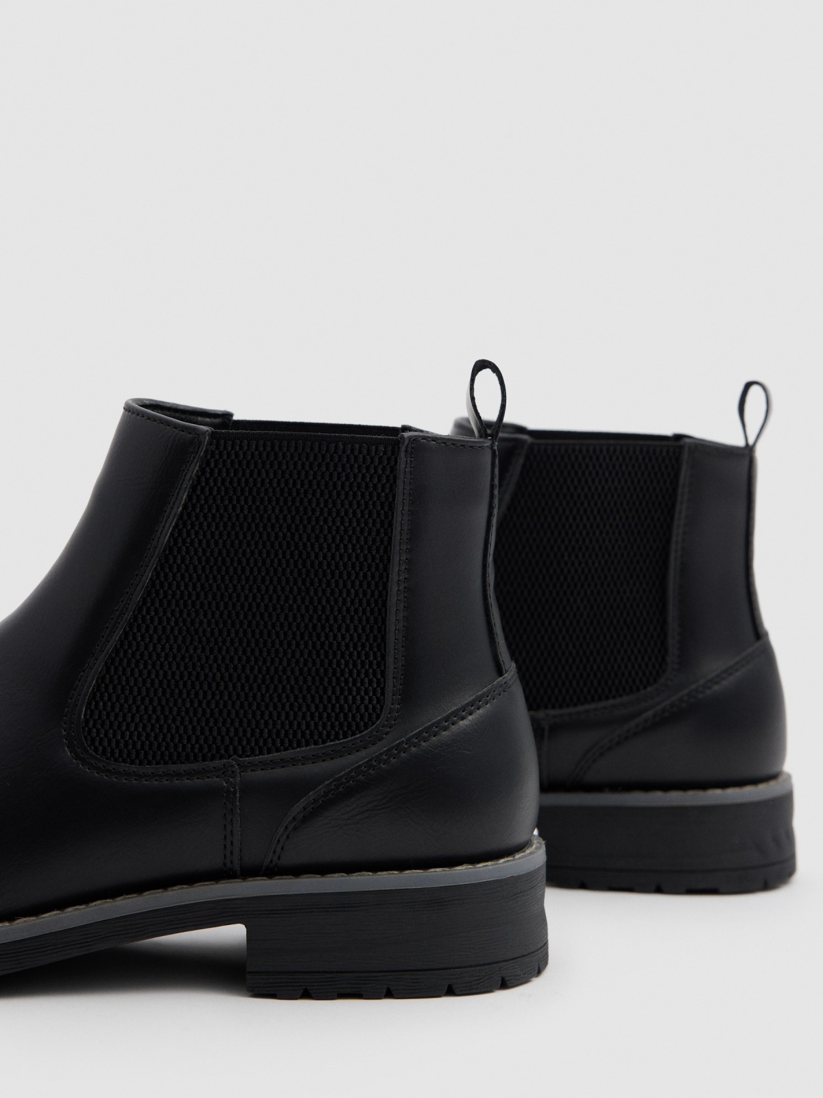 Black faux leather Chelsea boots black detail view