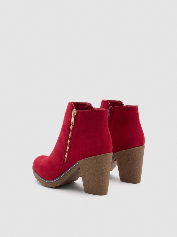 Heeled boots with double zipper red 45º back view