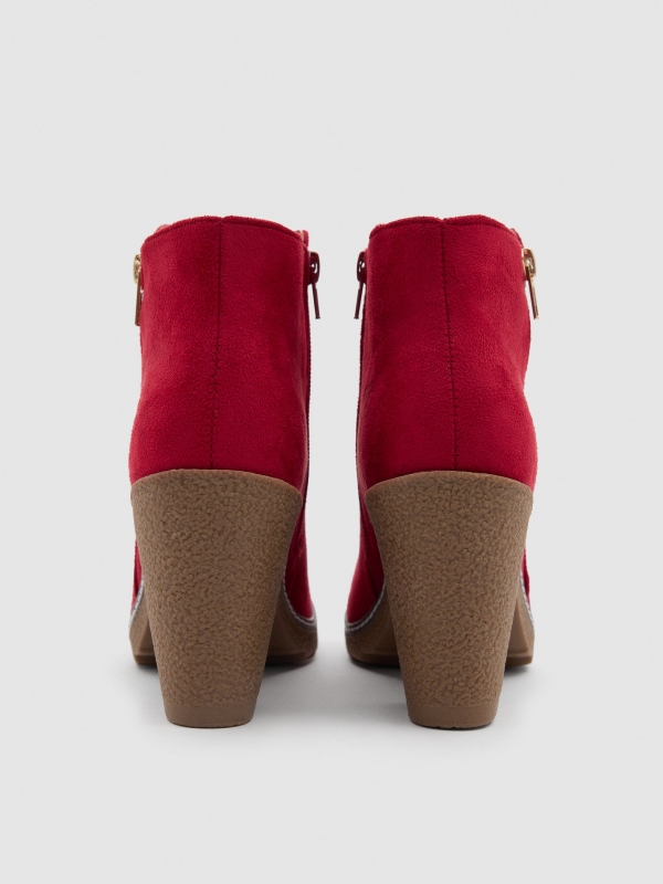 Heeled boots with double zipper red detail view